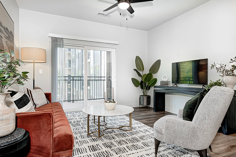 A modern apartment living room with various plants